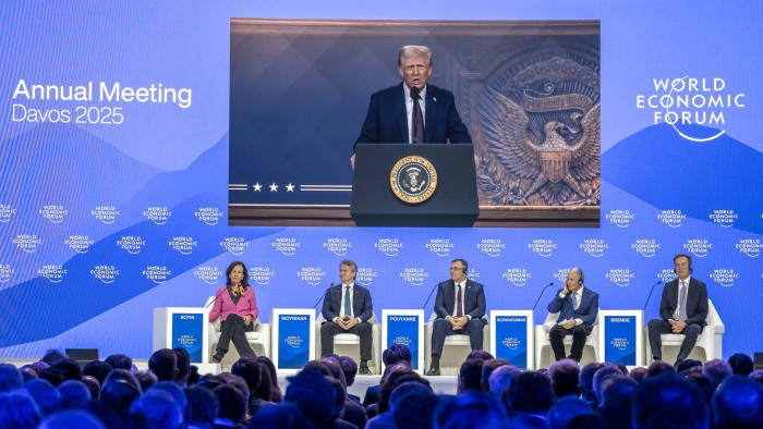 US president Donald Trump appears on a giant screen as he addresses the World Economic Forum in Davos