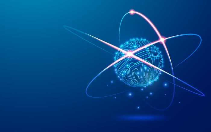 A round computer chip graphic surrounded by electrons.