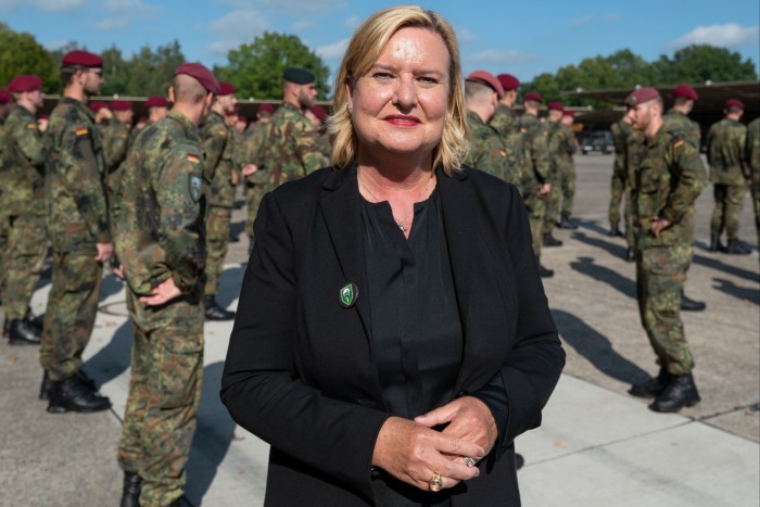 Germany’s armed forces commissioner, Eva Högl, and soldiers behind her