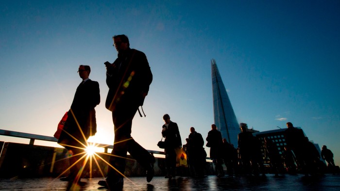 Commuters crossing London Bridge