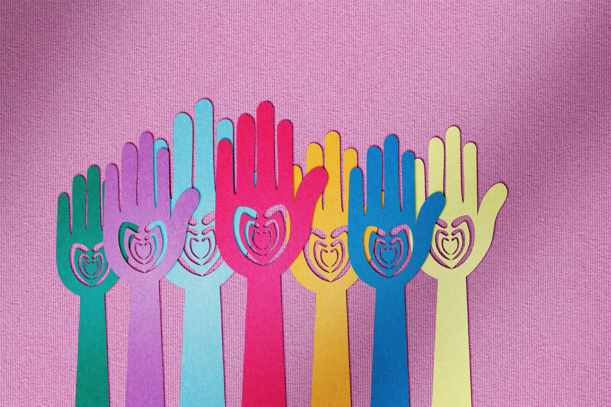 Charity and donating, paper cut hands with hearts
