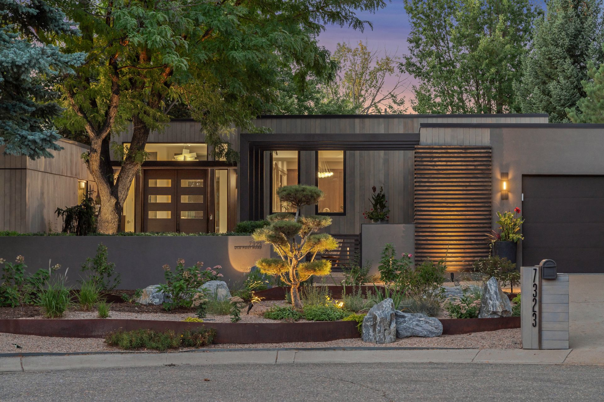 A modern home for sale in Boulder, Colorado by a golf course.