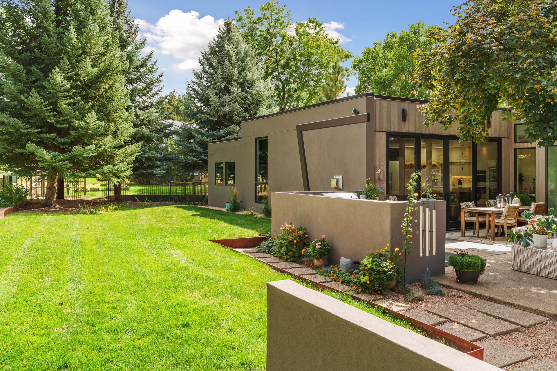 A modern home for sale in Boulder, Colorado by a golf course.
