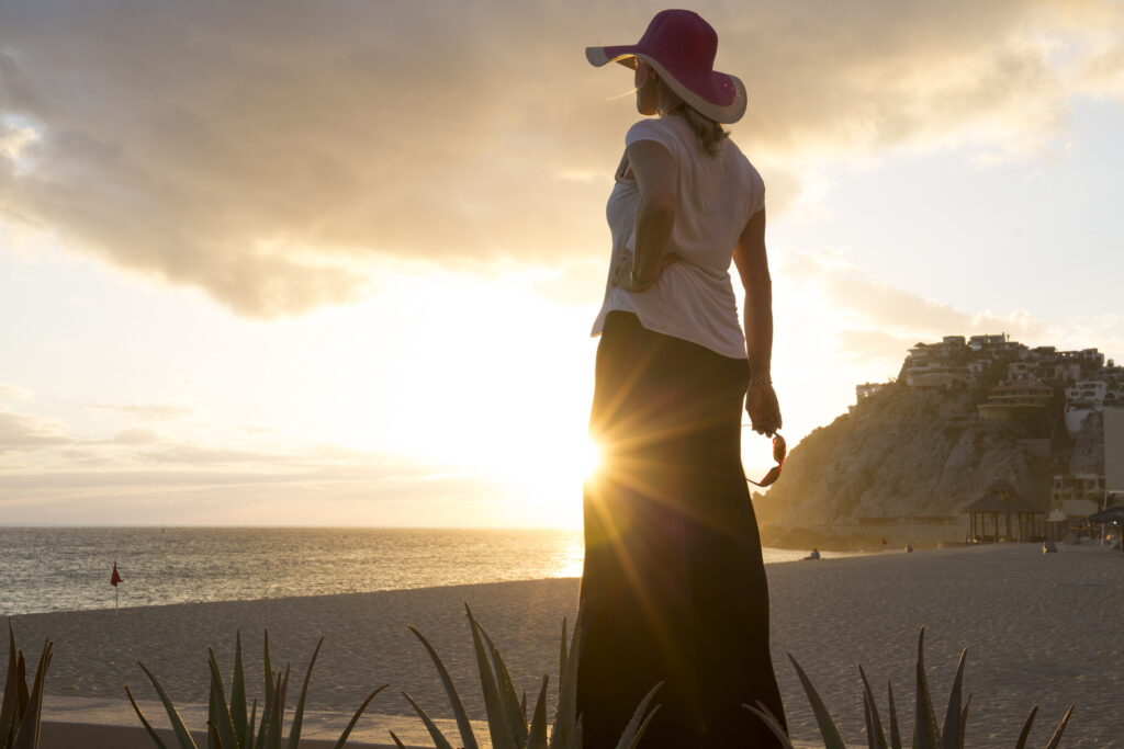 woman looking at the sunset in the Caribbean