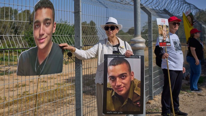 Varda Ben Baruch holds a picture of her grandson Edan Alexander, who is held hostage in Gaza