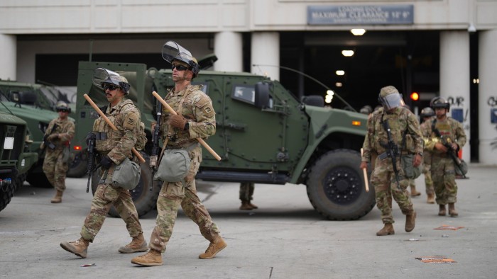 US National Guard members patrol central Los Angeles on Sunday