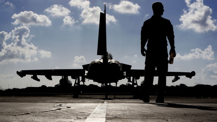 A British soldier and a Eurofighter Typhoon fighter jet at Royal Air Force’s Akrotiri base in Cyprus,