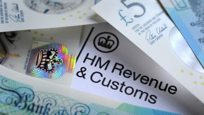 Banknotes on top of HMRC headed paper
