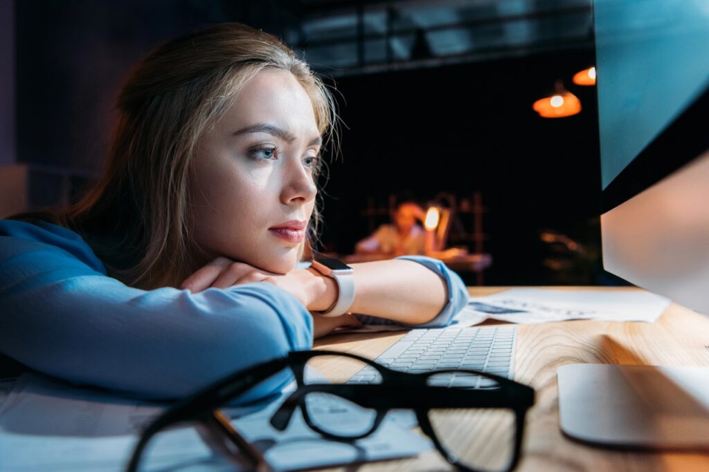 Tired student loan borrower waiting on SAVE | Source: DmitryPoch