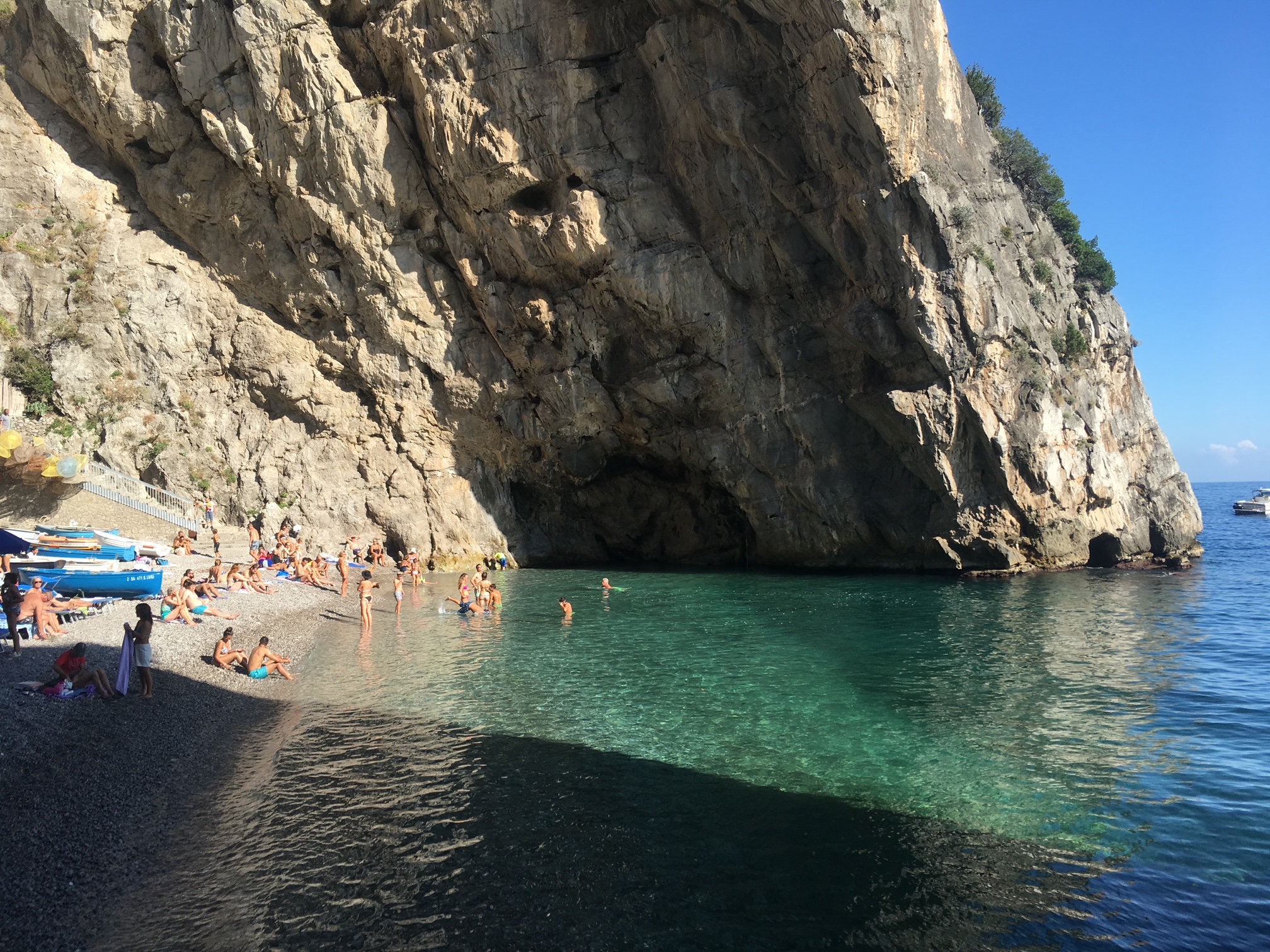 Swimmers on a beach on the Amalfi Coast.