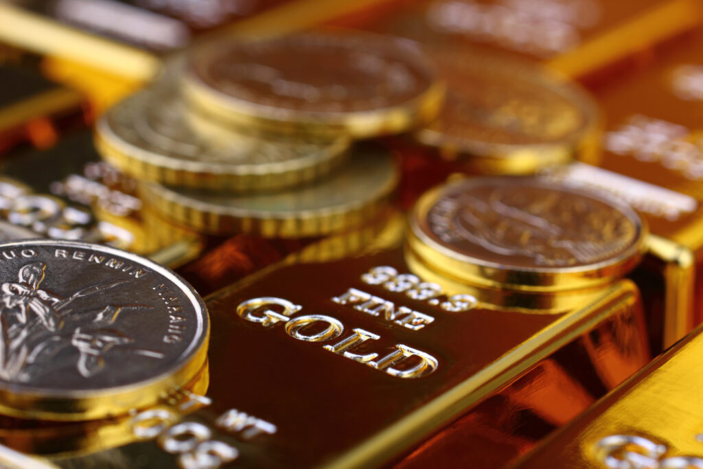 Close-up image of gold bars and coins