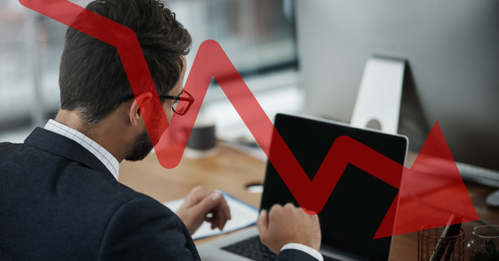 Office worker overlaid with declining unemployment | Source: The College Investor