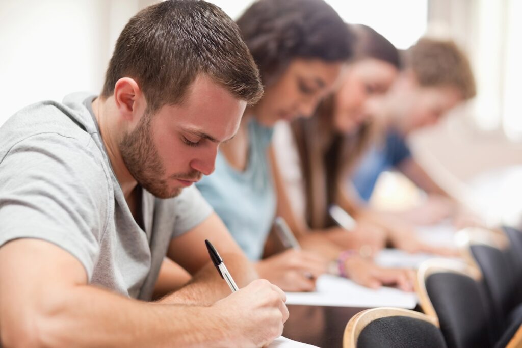 Students Taking The CLT Exam | Source: The College Investor