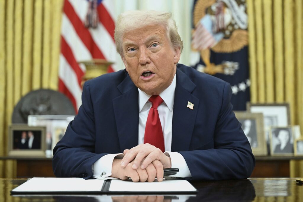 President Donald Trump speaks to reporters before signing an executive order in the Oval Office of the White House in Washington, Monday, March 31, 2025. (Pool via AP)