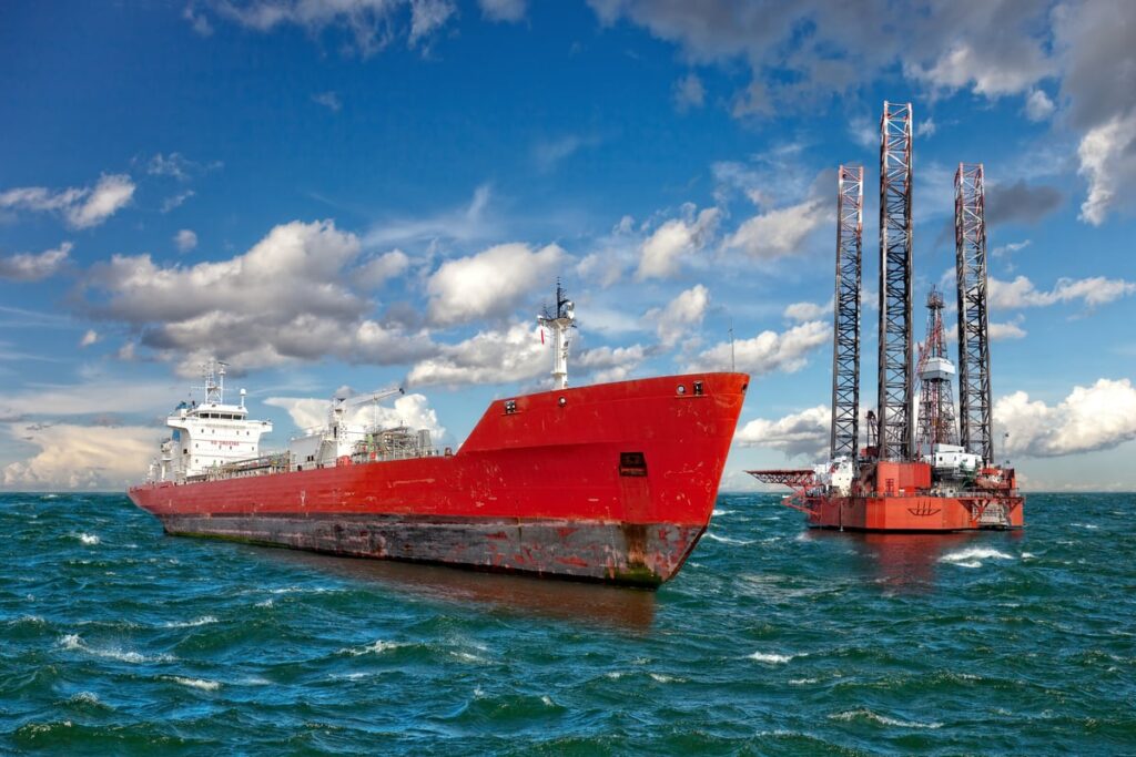 An oil rig and oil tanker.