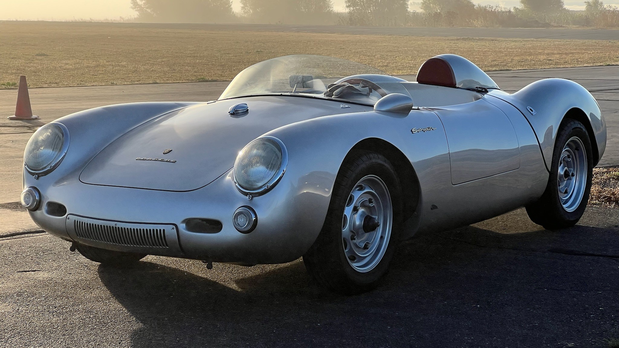 A silver Ferrari classic car.