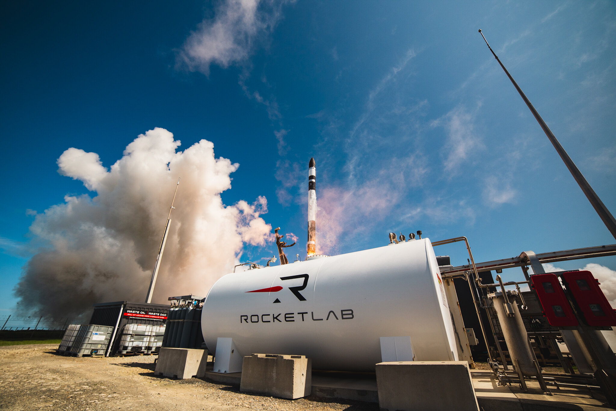 Rocket Lab's launch vehicle taking off from the launchpad. 