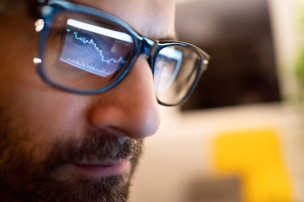 Close up of person looking at stock chart on computer.