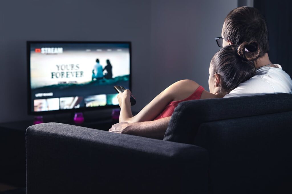A couple watching TV.