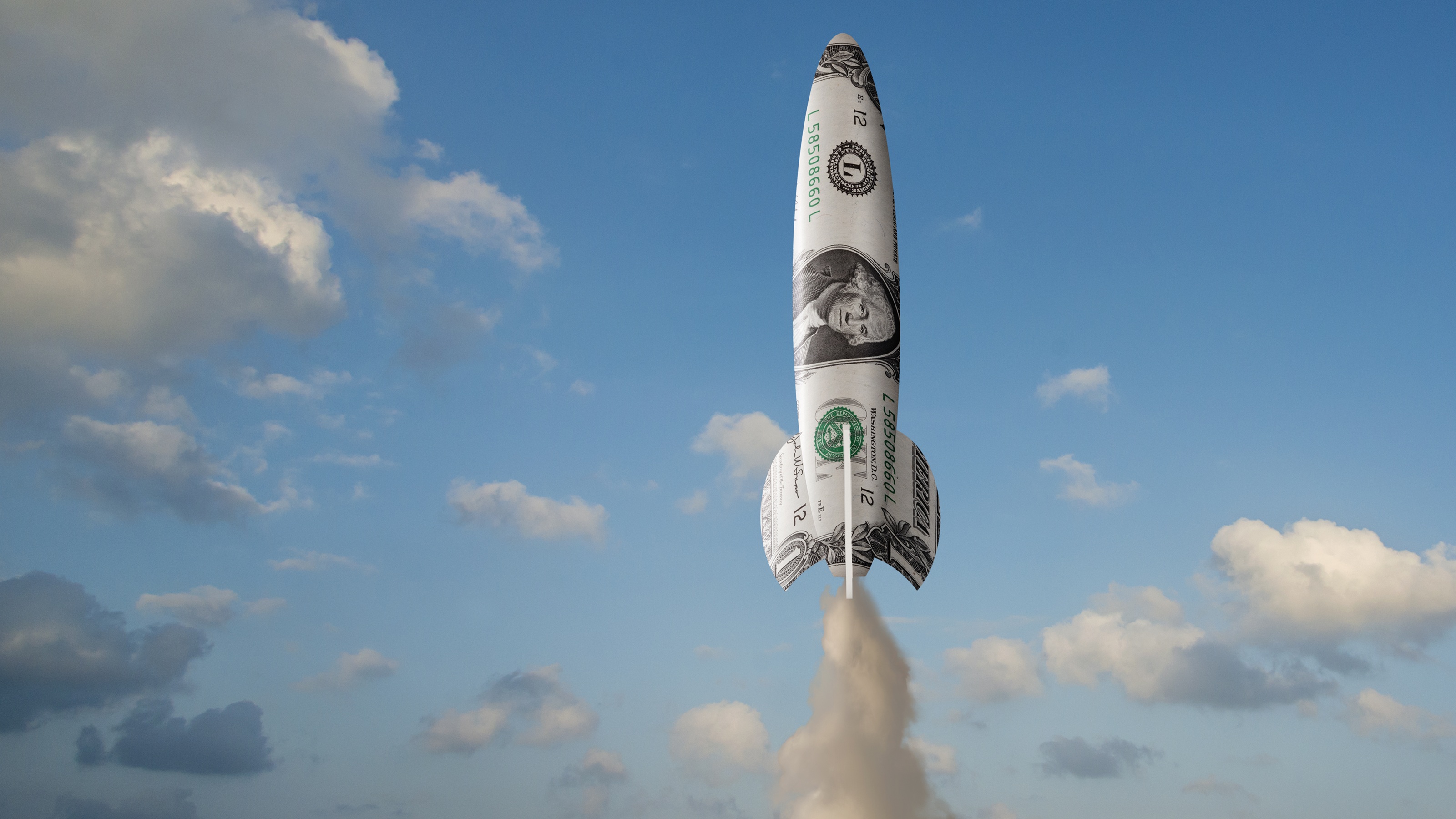 A rocket that looks wrapped in cash takes off.