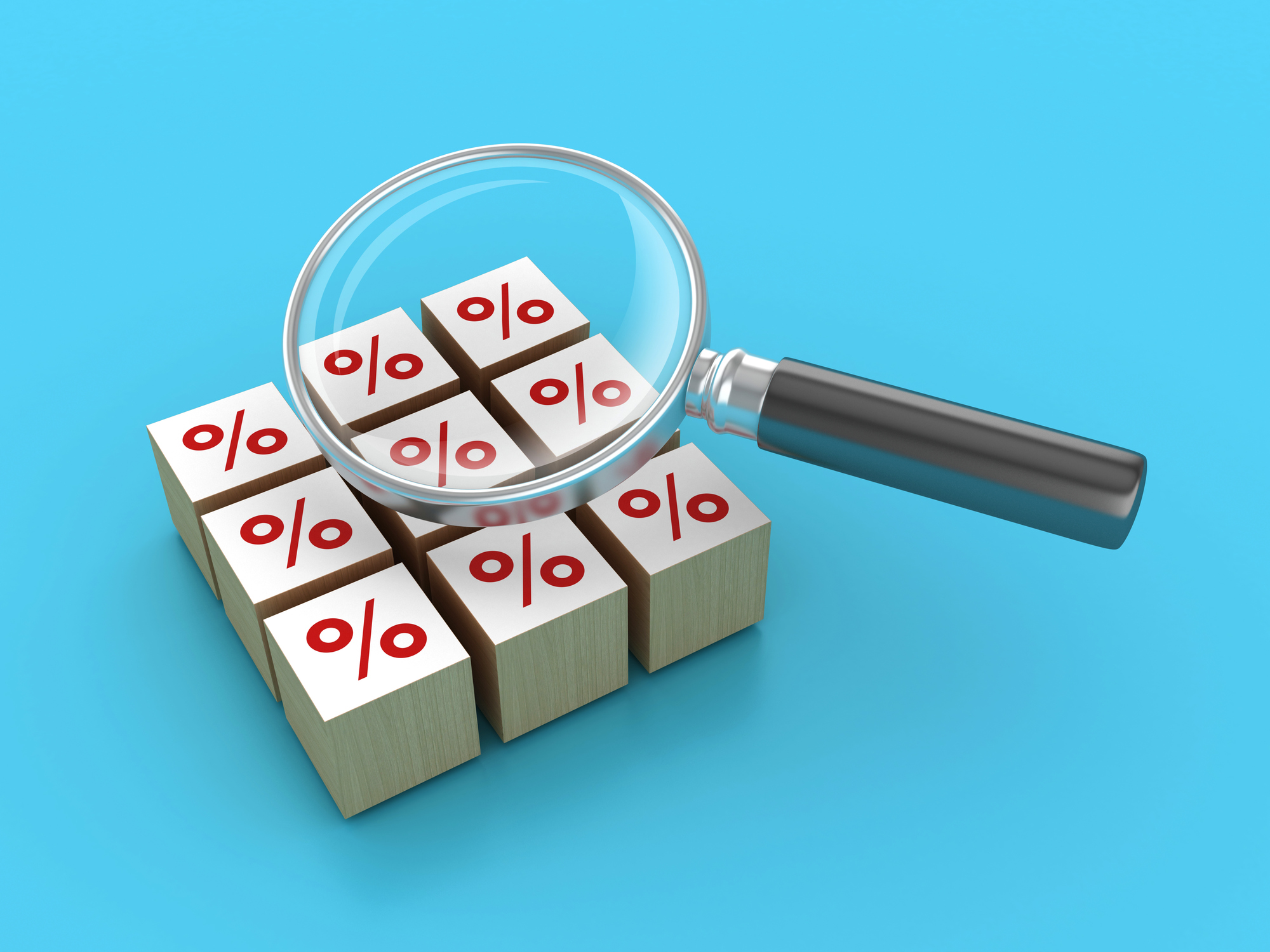 a magnifying glass looking at percentage tiles