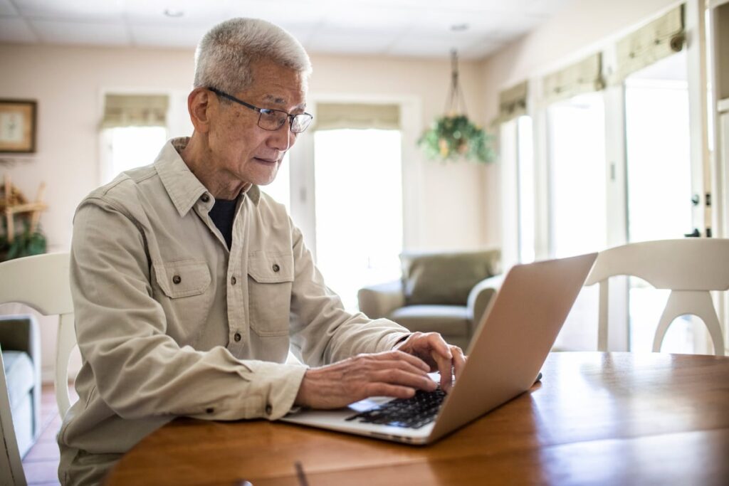 Adult looking at financial paperwork.
