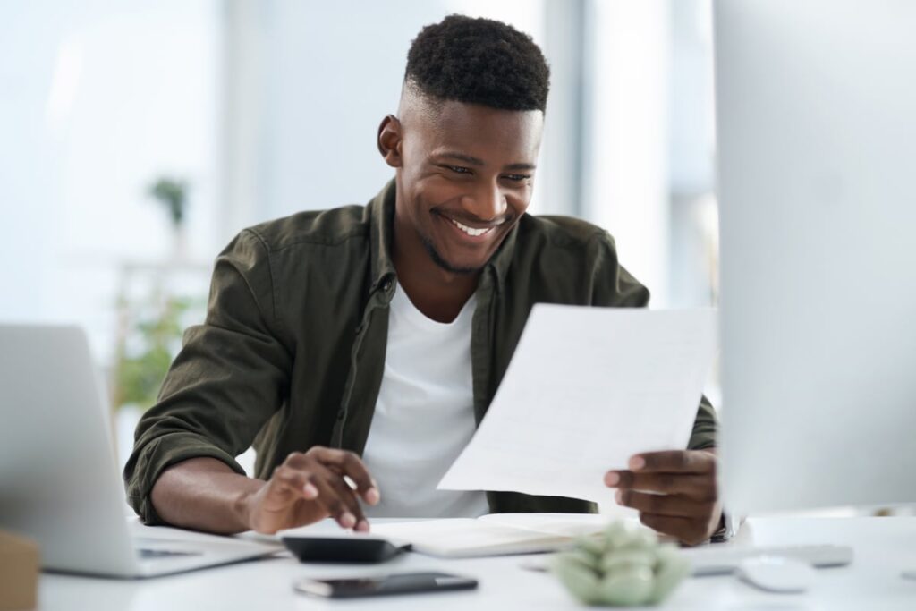 Adult looking at financial paperwork.