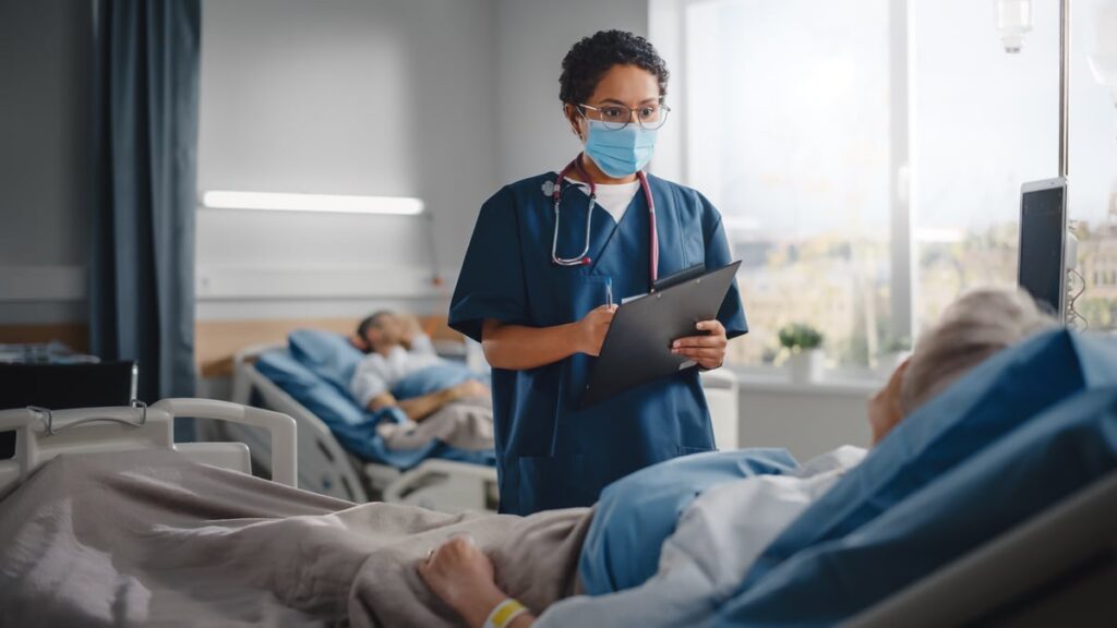 Doctor and patient in a hospital room.