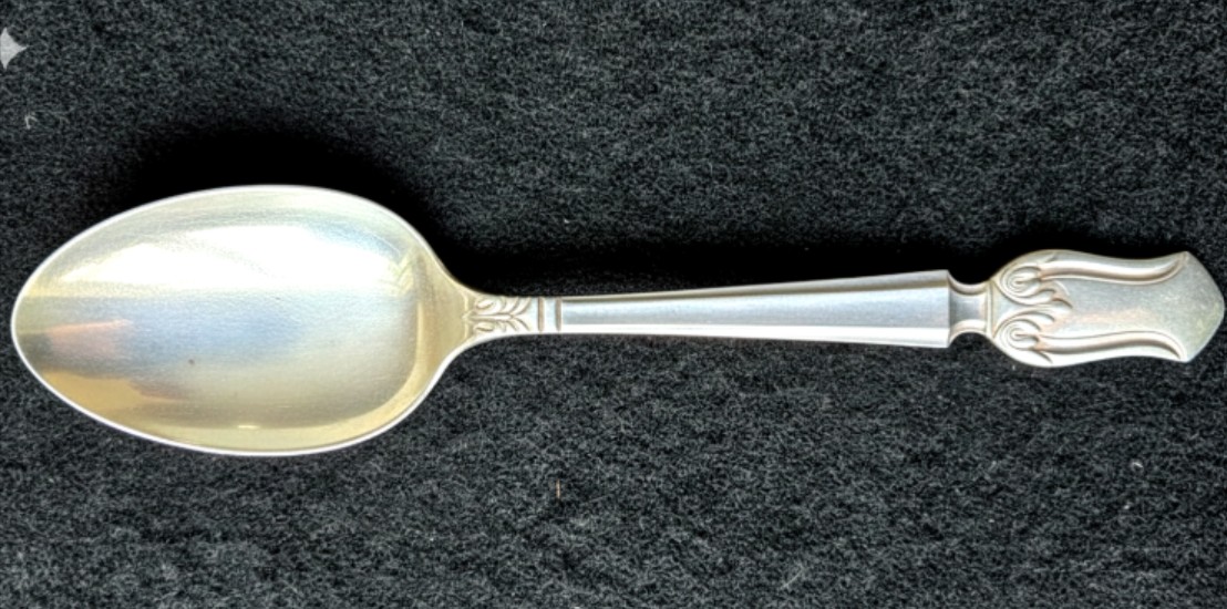 An antique, sterling silver spoon, 1937.