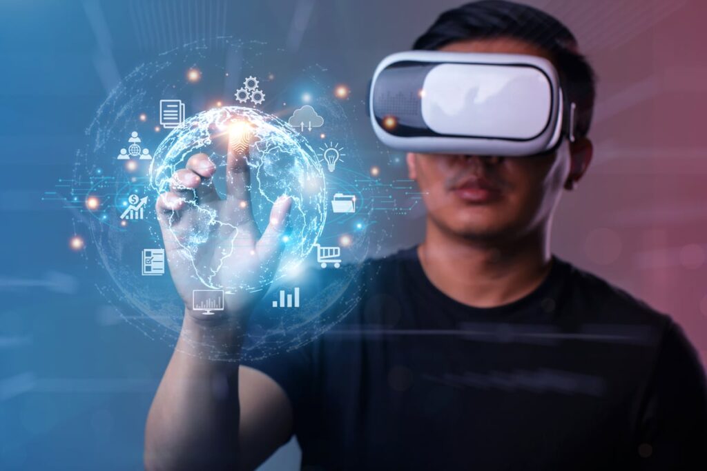 Man in virtual reality glasses holding hand up to lit up icons.