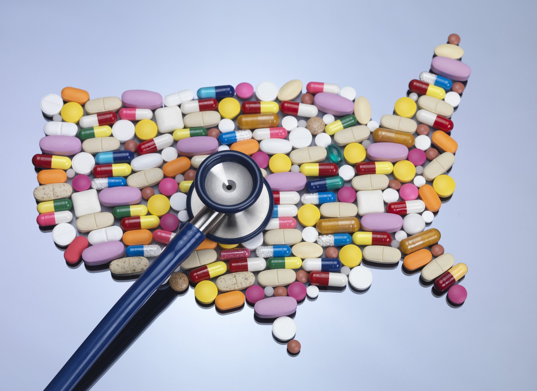 Map of United States of America made up of medicine with stethoscope.