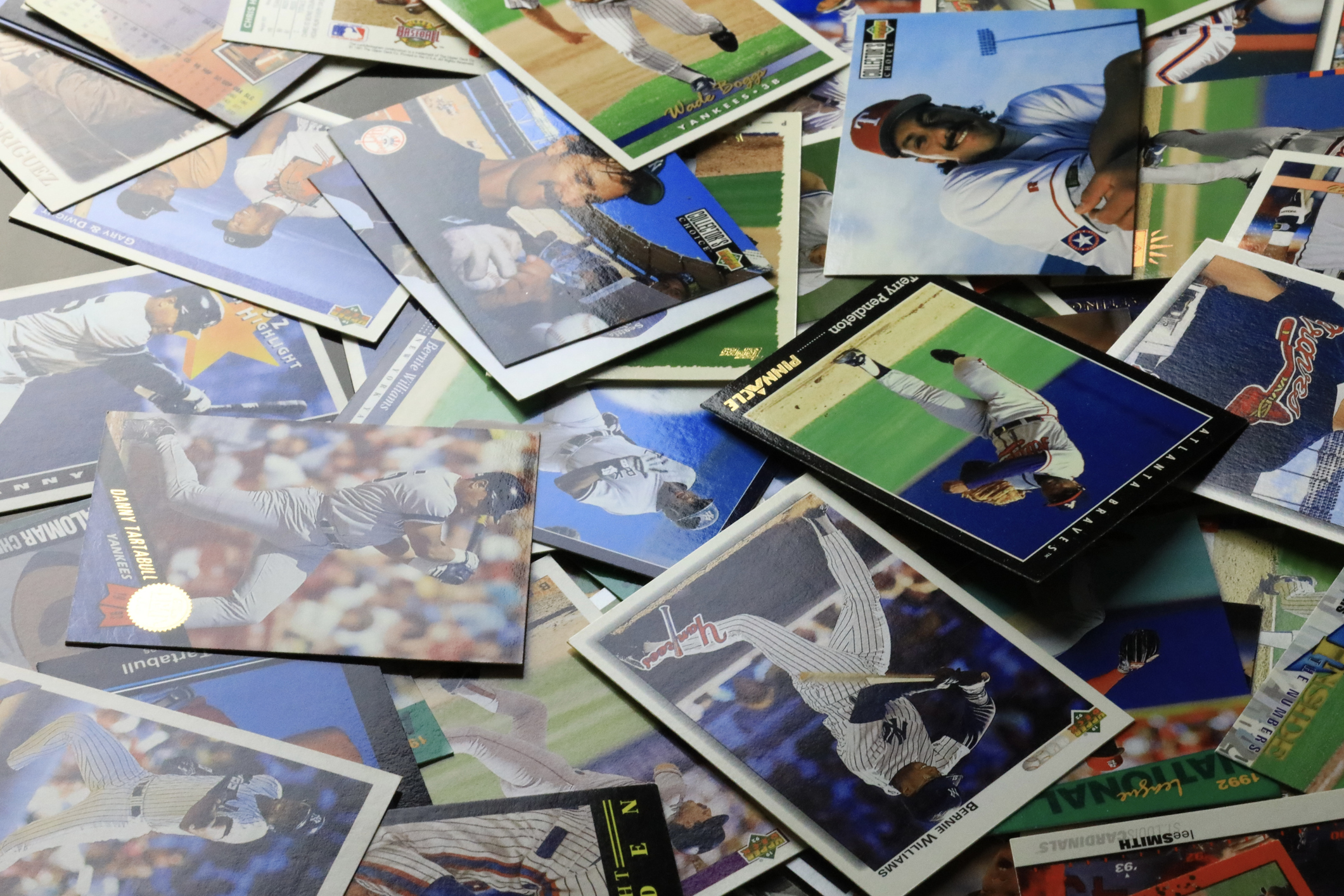 Baseball cards scattered on the table.