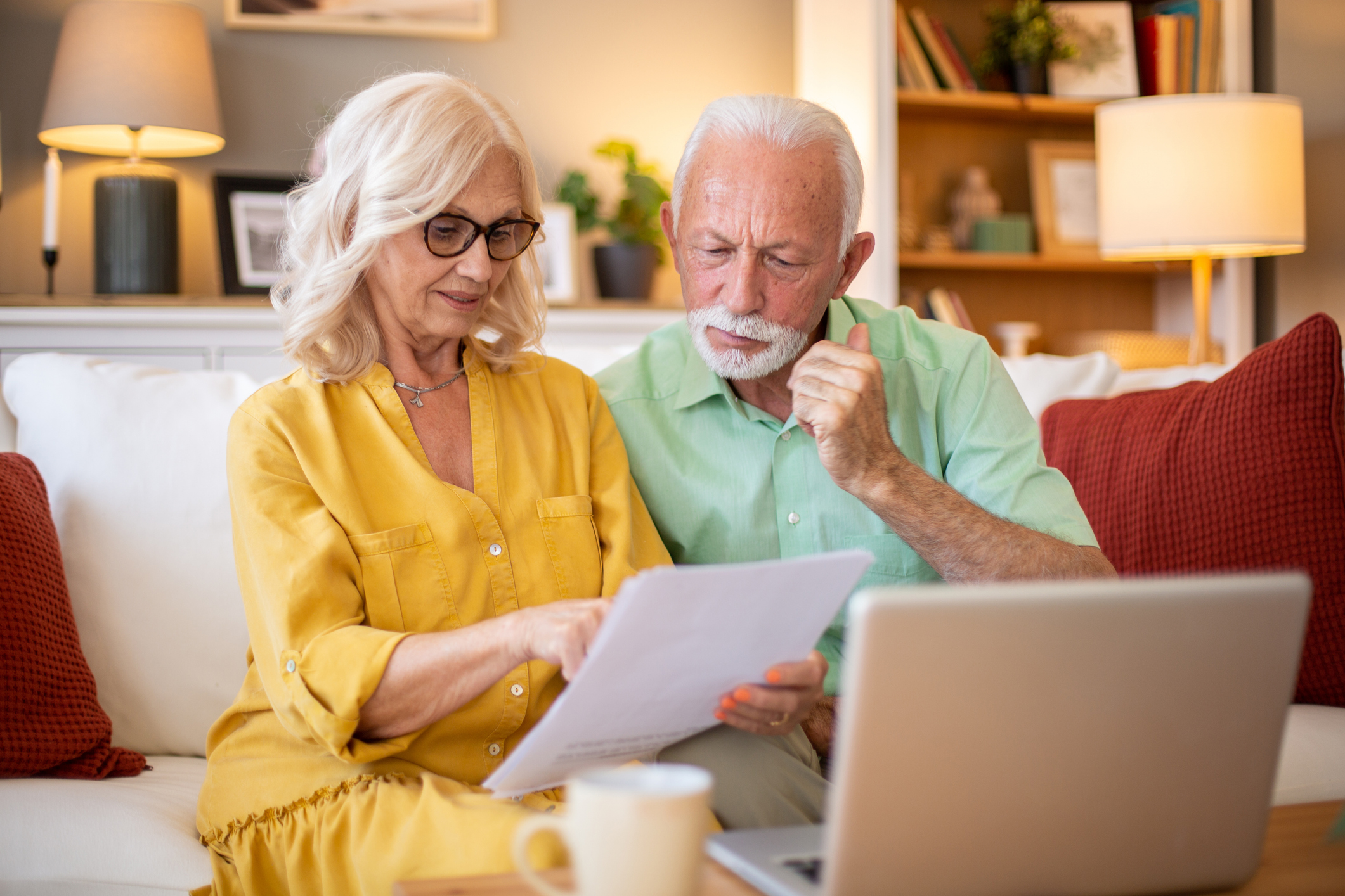 a happy couple making a financial decision
