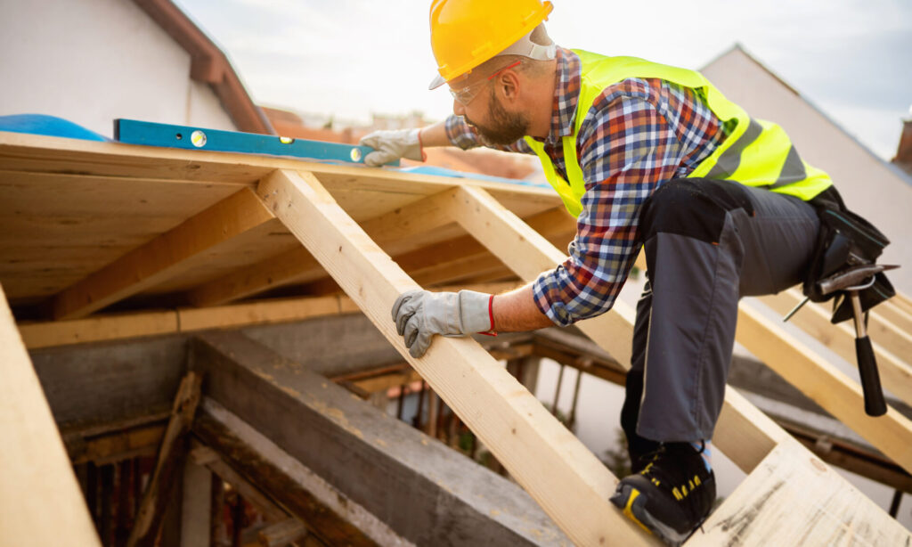 Roofer building a roof