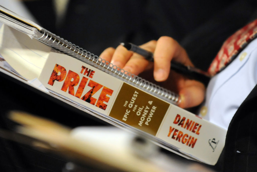 Dr. Daniel Yergin, Chairman of the Cambridge Energy Research Associates, holds his book "The Prize"
