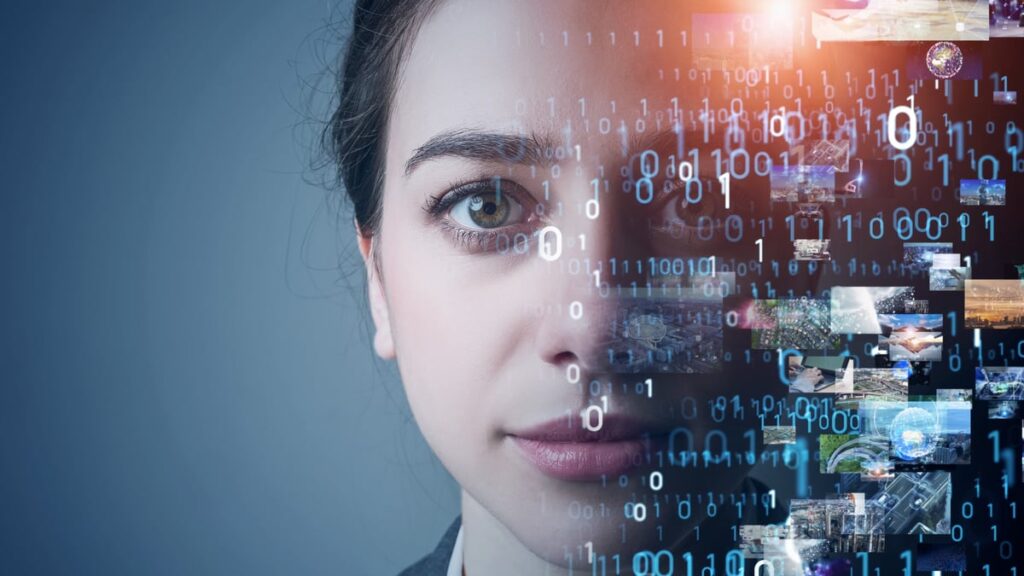 A woman's face morphing into digital images.