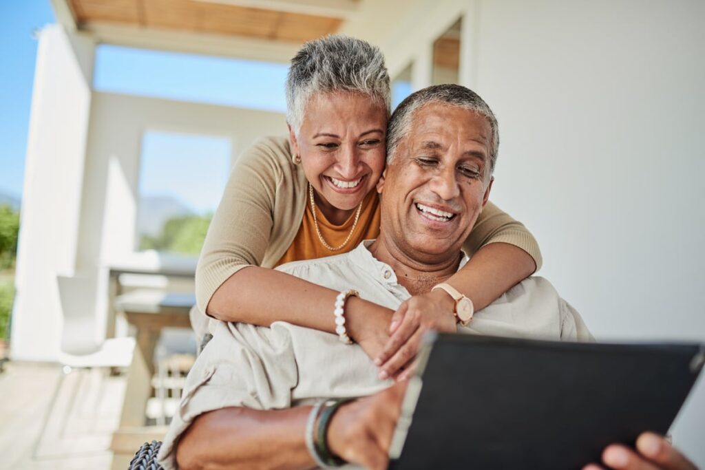 Happy couple looking at financial statements.