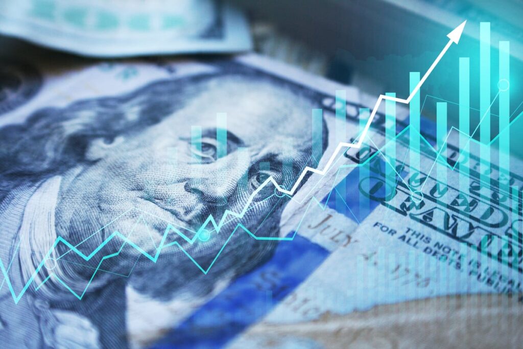 A hundred-dollar bill and an ascending chart.