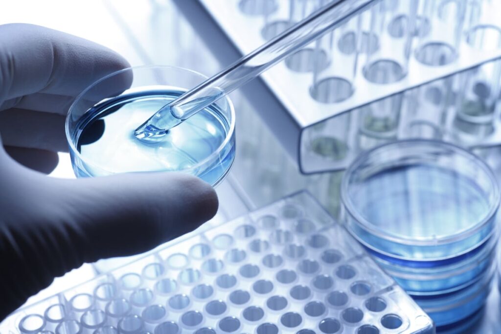 A biopharma lab technician is performing a clinical trial.