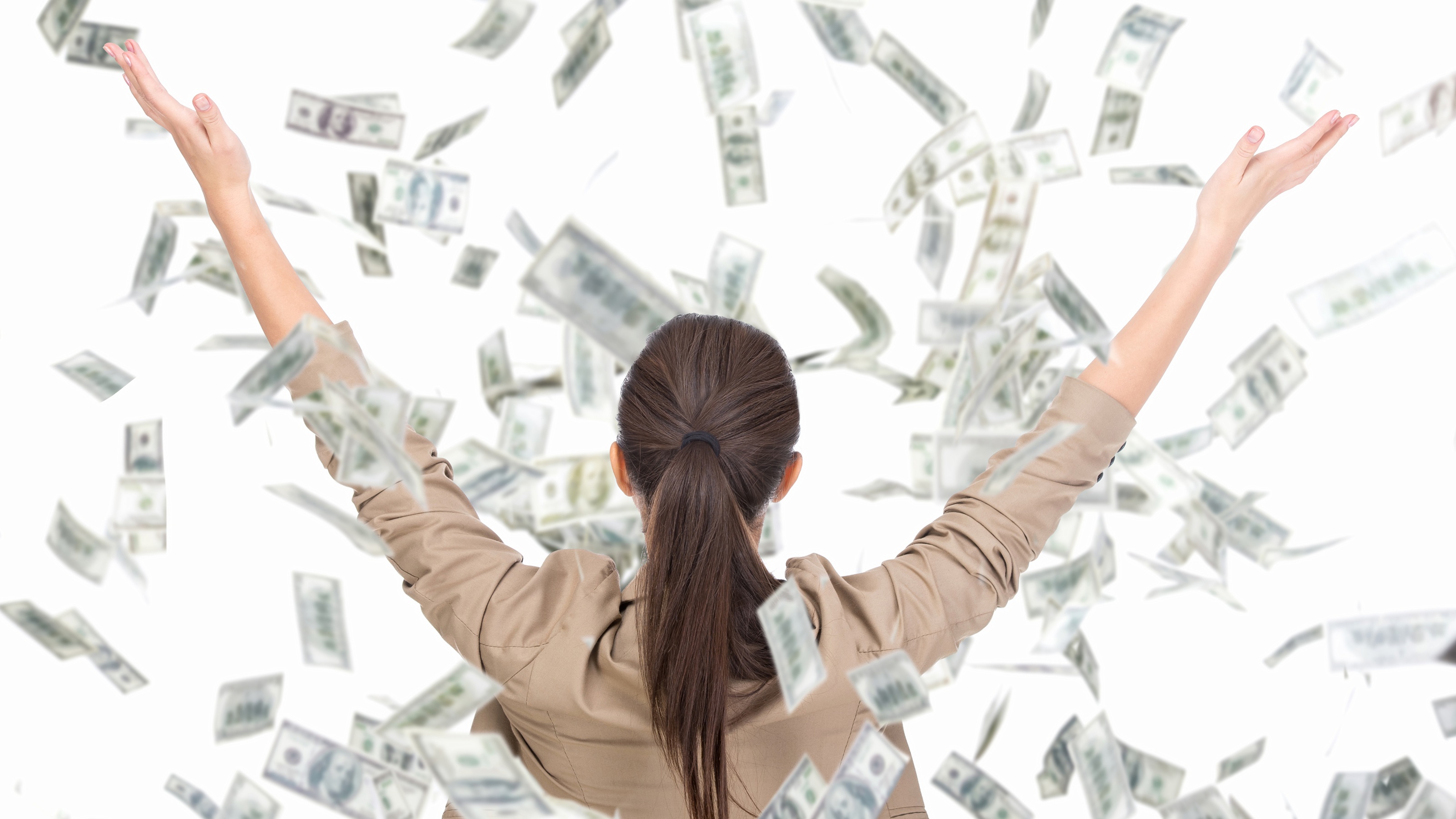 A woman throws cash into the air.