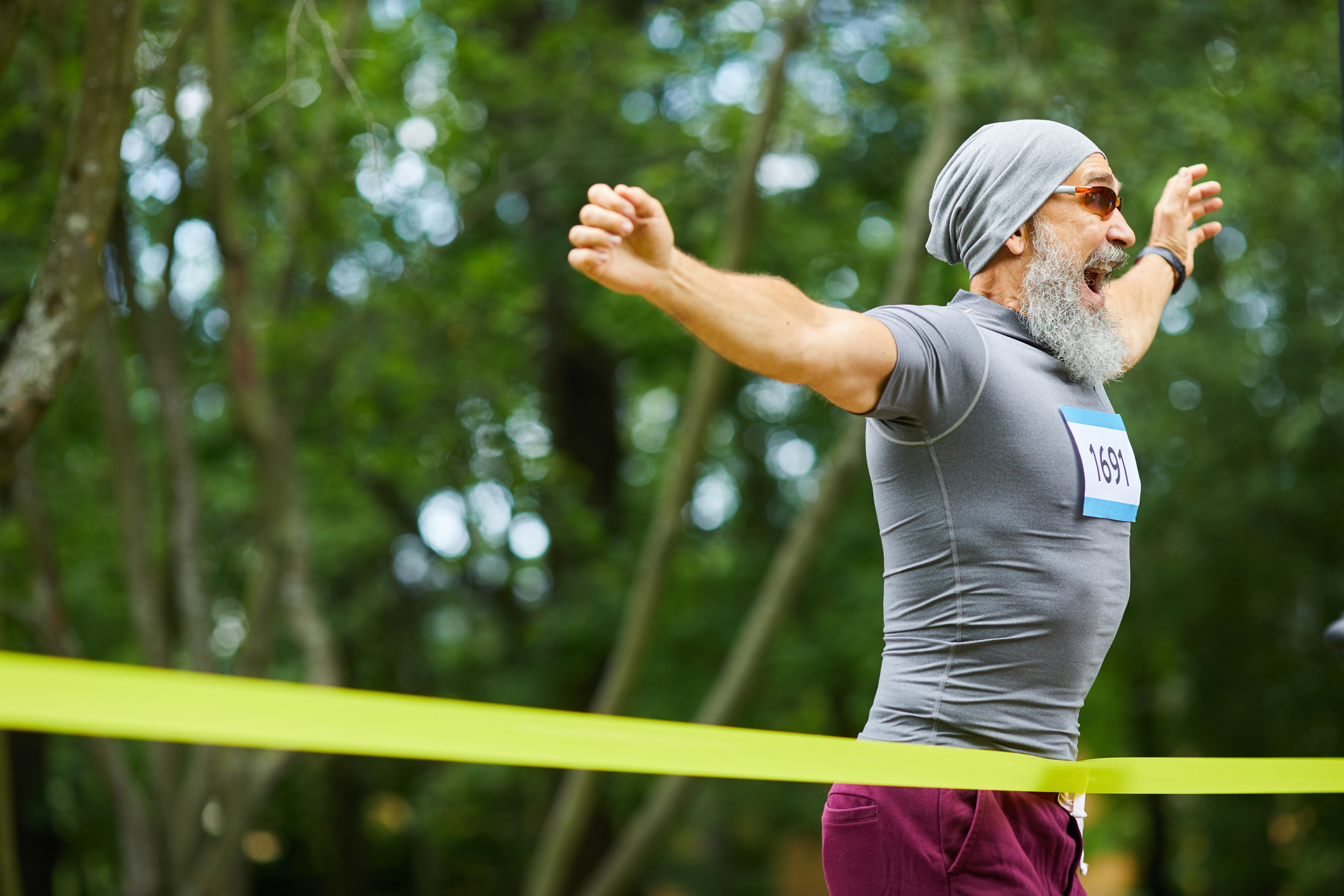 Older man finishing a race