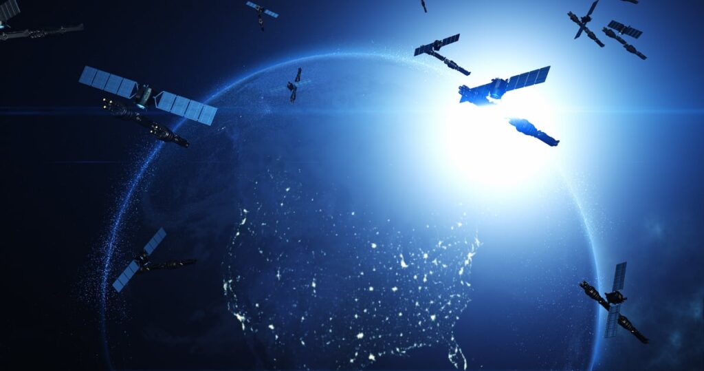 Concept image shows several satellites orbiting around planet Earth.