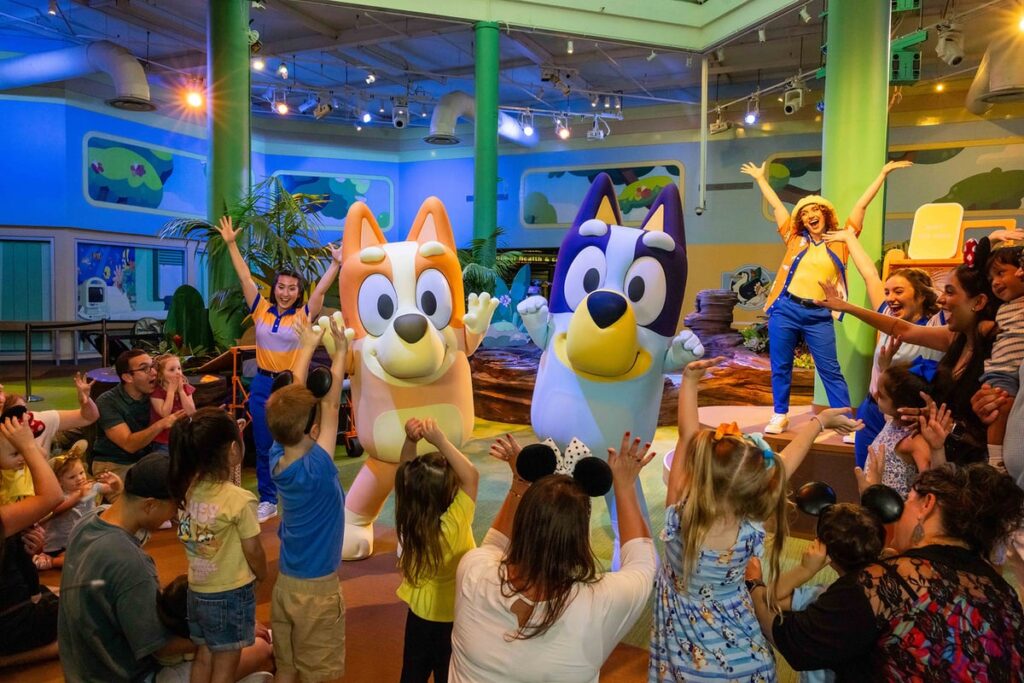 Bluey and Bingo entertain guests at the new Bluey's Wild World interactive experience at Disney's Animal Kingdom.