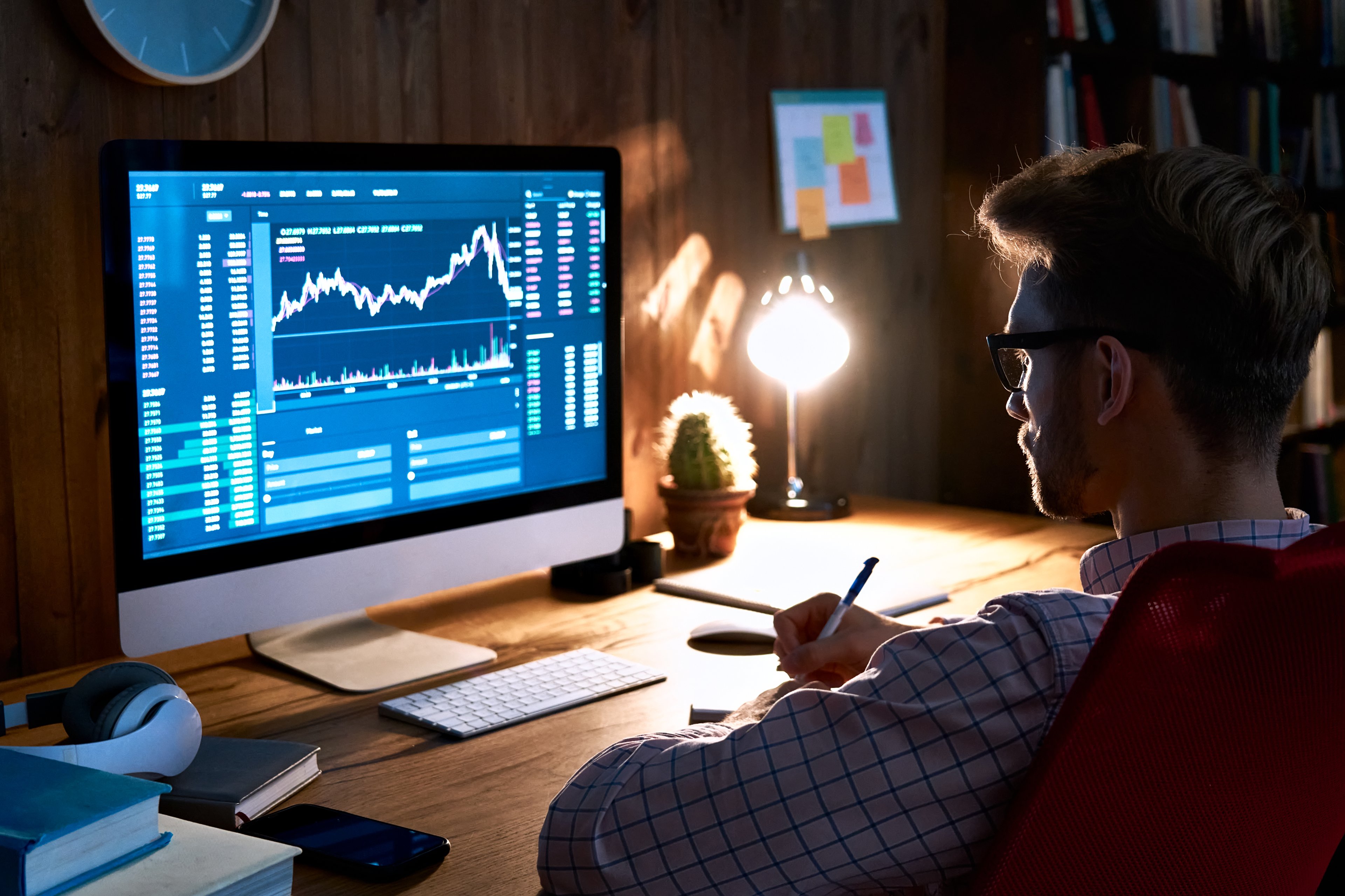 Person looking at a stock chart on a computer.