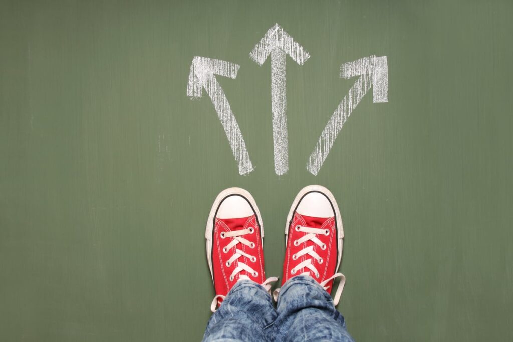 A pair of sneakers with arrows in front of them indicating options or alternatives choices.
