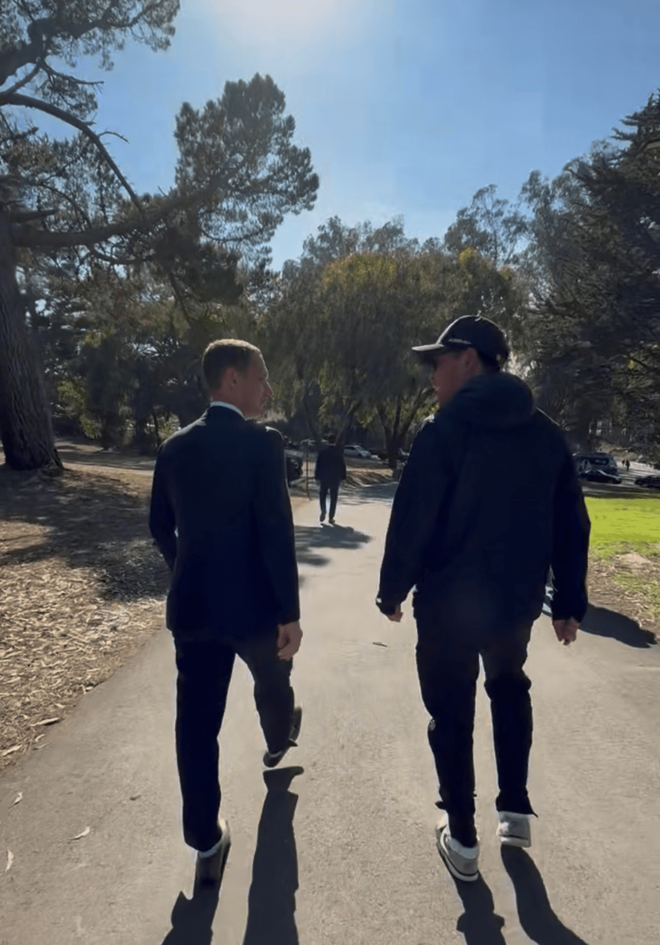 Sam Dogen chatting with San Francisco Mayor Daniel Lurie after Roger Federer's event at McClaren Park