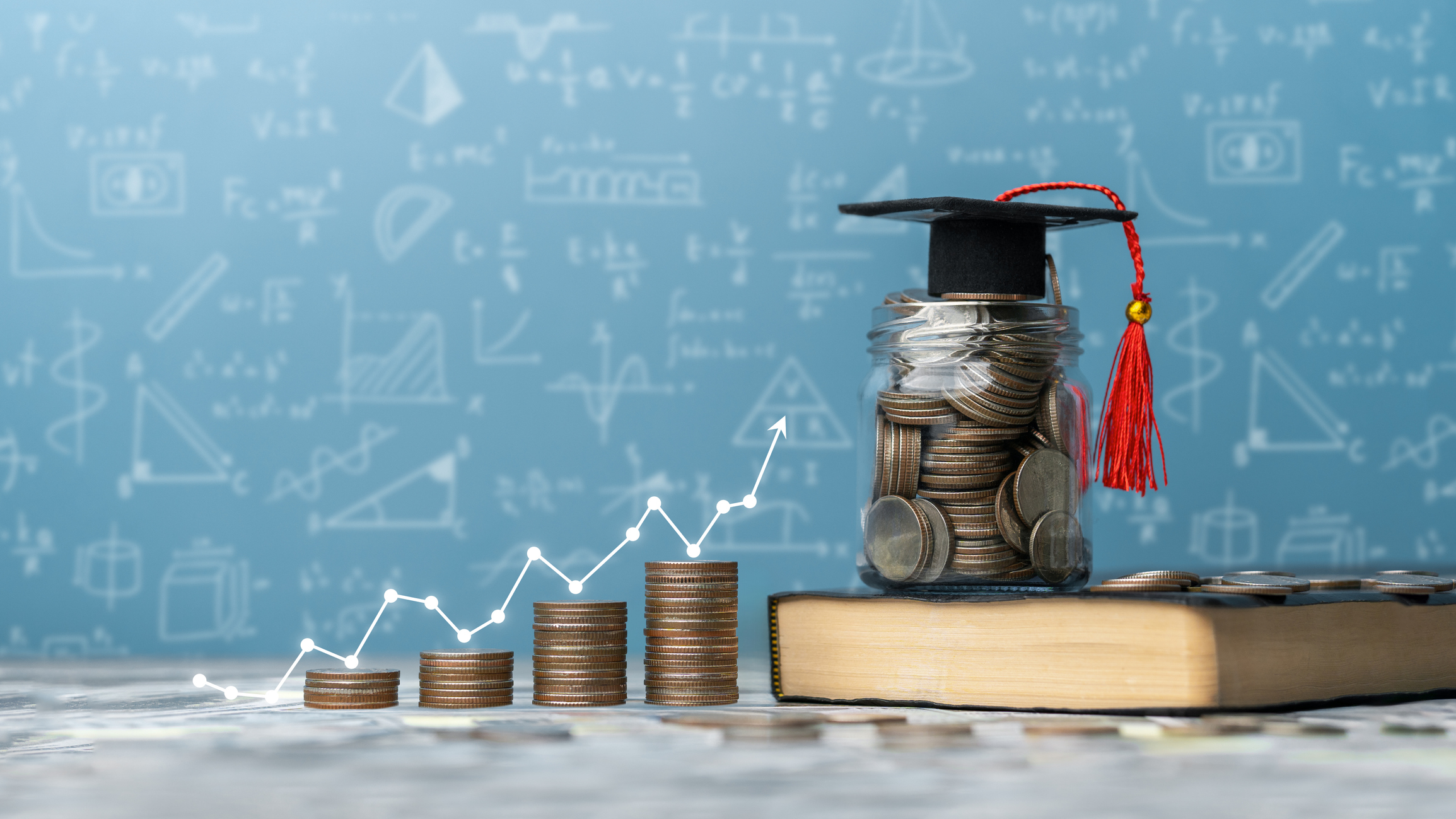 a stack of growing coins leading to a book with a fully piggy bank and a cap on top