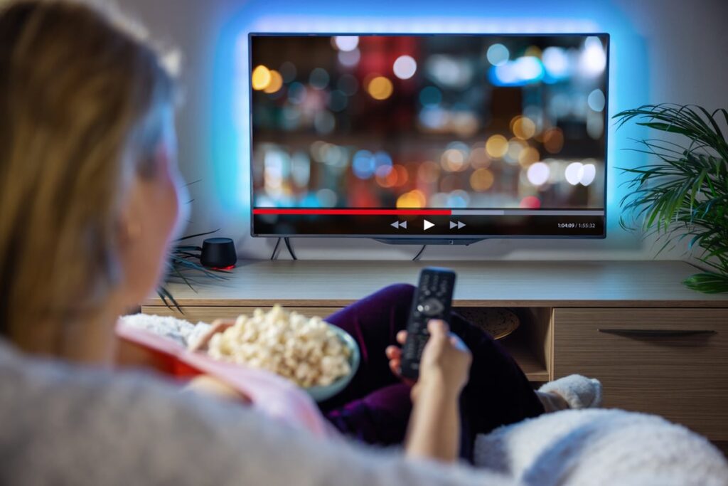 A person looks at a TV.