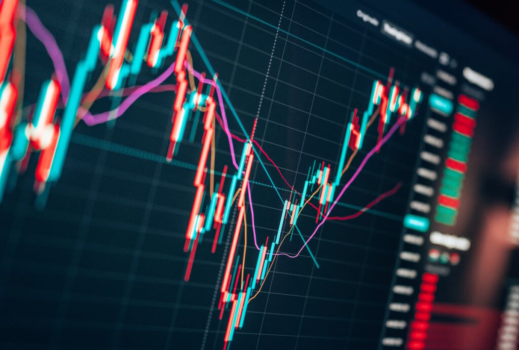A rapidly plunging then rising stock chart displayed on a computer monitor.