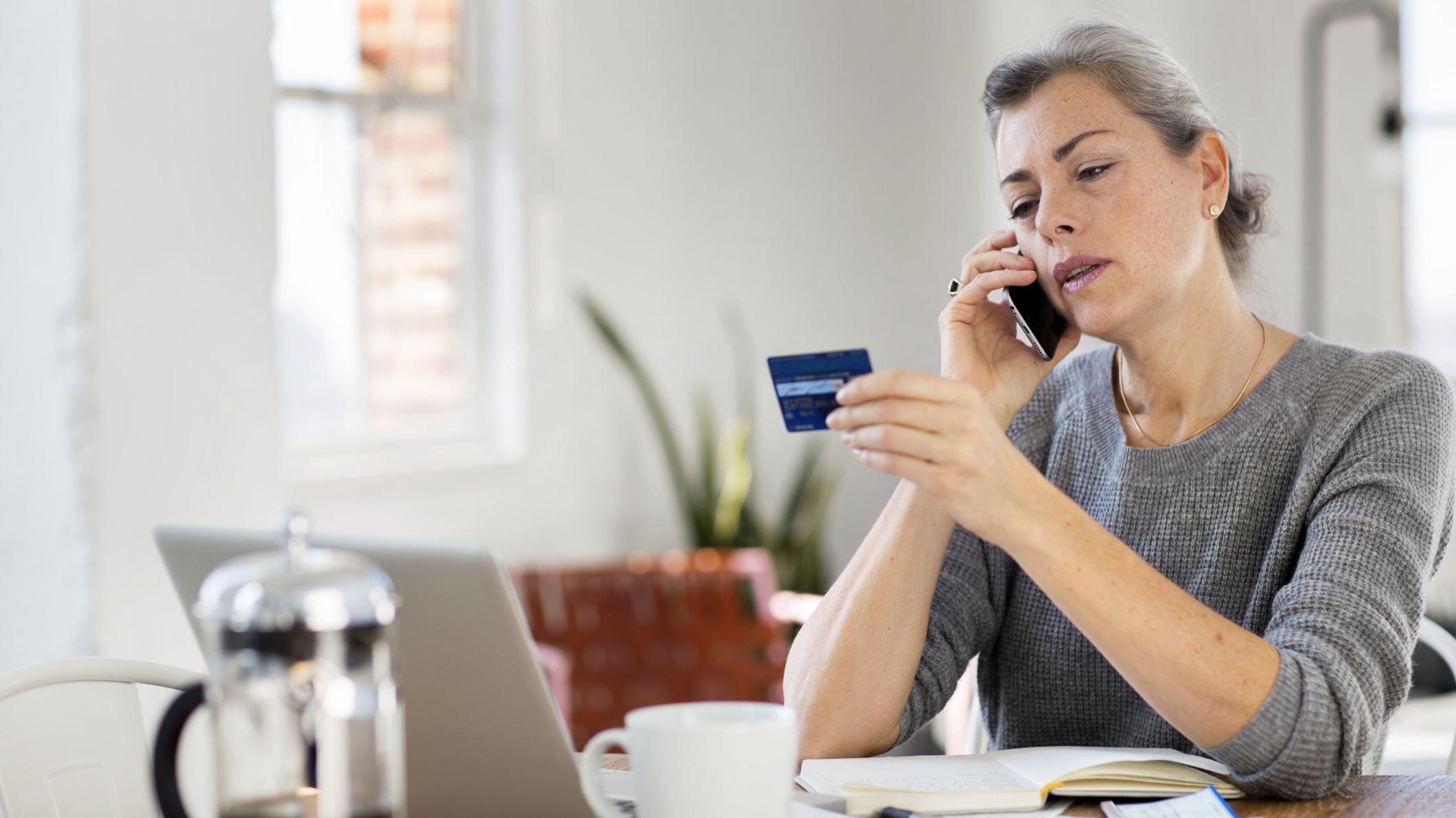 A woman on the phone with credit card customer service.